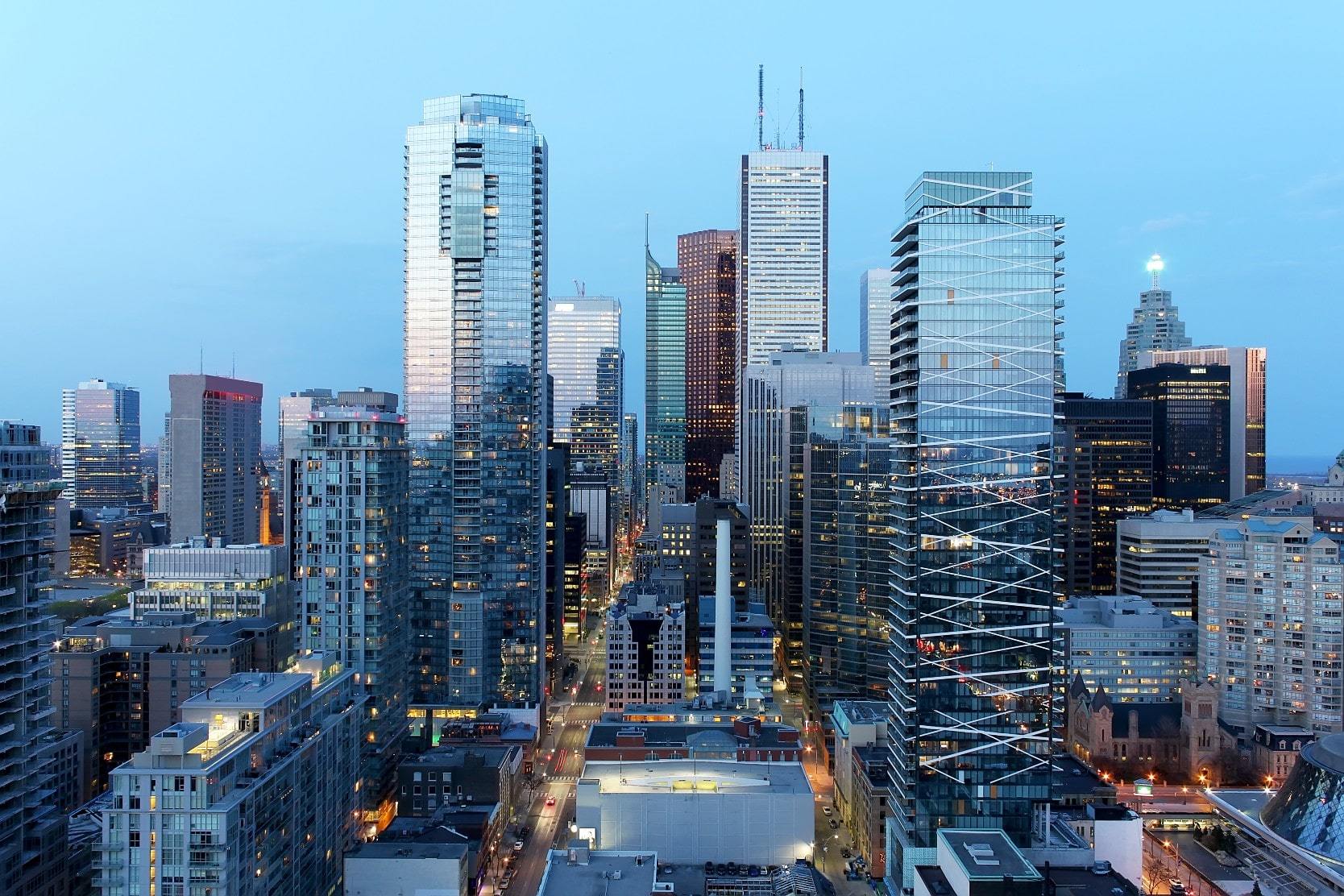 Toronto condos and skyscrapers against a blue sky